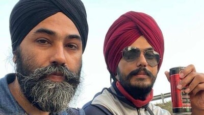 In the picture, it appears that Amritpal Singh and Papalpreet Singh are sitting atop a truck. In the picture, it appears that Amritpal Singh and Papalpreet Singh are sitting atop a truck.