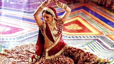 Madhuri Dixit in Devdas: The most expensive costume in the film Devdas was worn by Madhuri Dixit. The red lehenga was priced at <span class='webrupee'>₹</span>15 lakhs and weighed 30kgs. (Pinterest) Madhuri Dixit in Devdas: The most expensive costume in the film Devdas was worn by Madhuri Dixit. The red lehenga was priced at <span class='webrupee'>₹</span>15 lakhs and weighed 30kgs. (Pinterest)