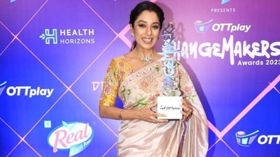 Rupali Ganguly smiles for the paparazzi while holding her OTTPlay Changemakers Award. She wore a floral embroidered saree styled with a half-sleeve blouse, minimal jewellery and soft glam picks. (HT Photo/Varinder Chawla) Rupali Ganguly smiles for the paparazzi while holding her OTTPlay Changemakers Award. She wore a floral embroidered saree styled with a half-sleeve blouse, minimal jewellery and soft glam picks. (HT Photo/Varinder Chawla)