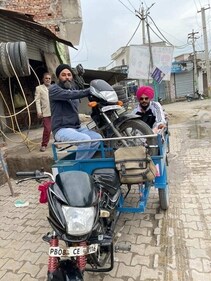 In another picture, Amritpal Singh and Papalpreet Singh can be seen sitting on a three-wheeler along with a bike. In another picture, Amritpal Singh and Papalpreet Singh can be seen sitting on a three-wheeler along with a bike.