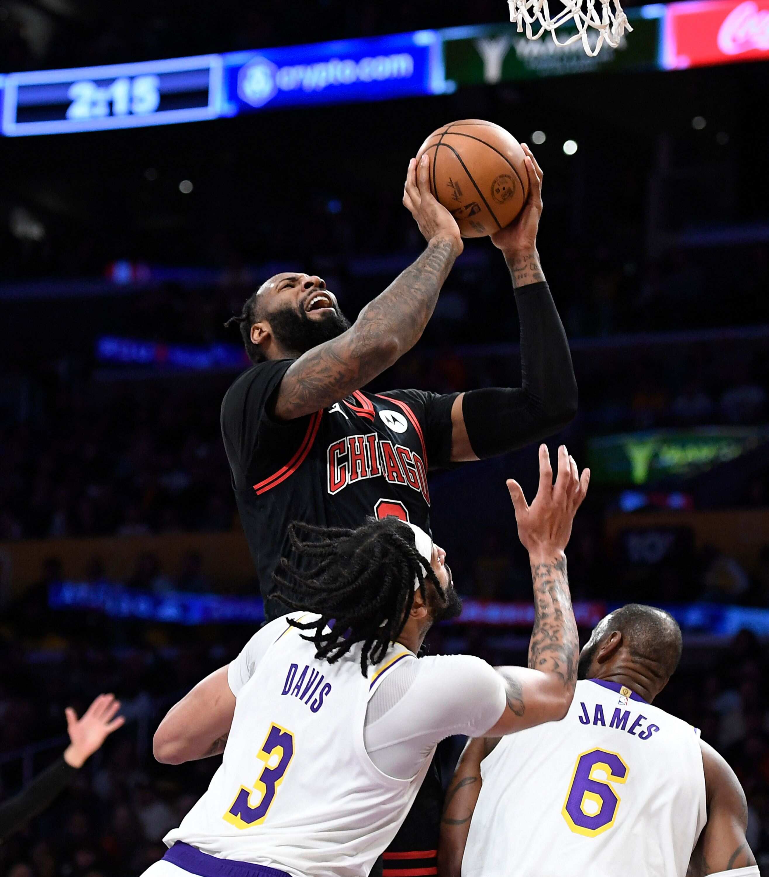 Andre Drummond #3 of the Chicago Bulls goes for a layup against LeBron James #6 and Anthony Davis #3 of the Los Angeles Lakers during the second half at Crypto.com Arena on March 26, 2023 in Los Angeles, (Getty Images via AFP) Andre Drummond #3 of the Chicago Bulls goes for a layup against LeBron James #6 and Anthony Davis #3 of the Los Angeles Lakers during the second half at Crypto.com Arena on March 26, 2023 in Los Angeles, (Getty Images via AFP)