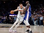  Denver Nuggets center Nikola Jokic (15) drives to the basket against Philadelphia 76ers center Dewayne Dedmon (14) in the first quarter at Ball Arena. Mandatory Credit: Isaiah J. Downing-