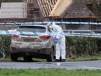 A forensic officer from Police Service of Northern Ireland (PSNI) works at the scene of the Youth Sport Omagh sports complex on Killyclogher Road area, where off-duty PSNI Detective Chief Inspector John Caldwell was shot, in Omagh, Northern Ireland February 23. 