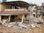Ecuador Landslide: A rescuer with a sniffer dog search for victims following a landslide in Alausi, Ecuador.
