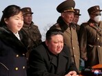 North Korean leader Kim Jong Un and his daughter Kim Ju Ae watch a missile drill at an undisclosed location.