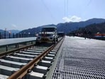 Mahindra Bolero is running on track, leading the inspection trolleys.