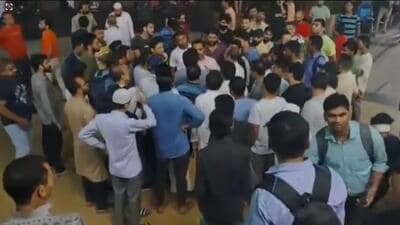 A screengrab of a video shows residents of the society confronting people from outside the complex in an attempt to resolve the issue. (Twitter) A screengrab of a video shows residents of the society confronting people from outside the complex in an attempt to resolve the issue. (Twitter)