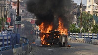 Angry locals torched police vehicles during a protest on Monday over the death of the 7-year-old girl in Kolkata. (ANI Photo) Angry locals torched police vehicles during a protest on Monday over the death of the 7-year-old girl in Kolkata. (ANI Photo)