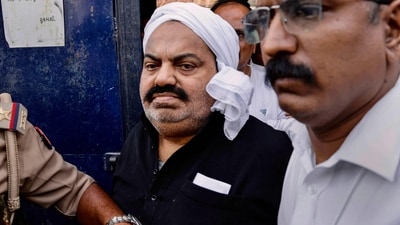 UP Police with jailed-mafia Atiq Ahmed outside Sabarmati Central Jail as he is being shifted to Prayagraj, in Ahmedabad. (PTI) UP Police with jailed-mafia Atiq Ahmed outside Sabarmati Central Jail as he is being shifted to Prayagraj, in Ahmedabad. (PTI)