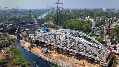 NCRTC officials said the agency has so far successfully placed six major spans over a 350-metre stretch on the RRTS corridor and one over the Ghazipur drain. (PTI) NCRTC officials said the agency has so far successfully placed six major spans over a 350-metre stretch on the RRTS corridor and one over the Ghazipur drain. (PTI)