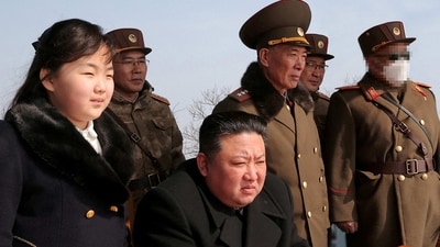 North Korean leader Kim Jong Un and his daughter Kim Ju Ae watch a missile drill at an undisclosed location. (via REUTERS)