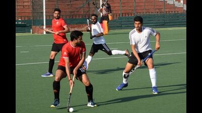 Players in action during the IA & AD Inter-Zonal Hockey Tournament at the Sector 42 Hockey Stadium in Chandigarh on Tuesday. (HT Photo) Players in action during the IA & AD Inter-Zonal Hockey Tournament at the Sector 42 Hockey Stadium in Chandigarh on Tuesday. (HT Photo)