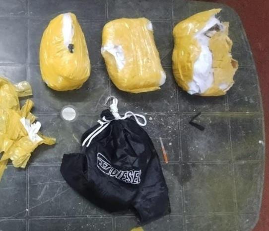 A big packet wrapped with yellow coloured adhesive tape and a small torch were found during the search. (HT Photo) A big packet wrapped with yellow coloured adhesive tape and a small torch were found during the search. (HT Photo)
