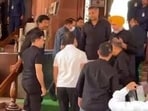 Rahul Gandhi (in white) entering the Parliament House complex on Wednesday as MPs including Karti Chidambaram, clad in black, welcome him. 