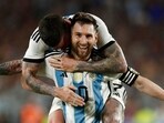 Argentina's Lionel Messi celebrates with Rodrigo De Paul after scoring their second goal 