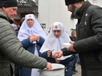 Nuns of Ukrainian Orthodox Church receive communion at the historic Kyiv-Pechersk Lavra in Kyiv on Wednesday. Nuns of Ukrainian Orthodox Church receive communion at the historic Kyiv-Pechersk Lavra in Kyiv on Wednesday.
