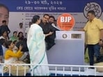 Mamata Banerjee uses 'BJP washing machine' at protest site 