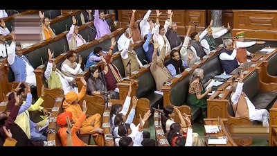 **EDS: VIDEO GRAB VIA SANSAD TV** New Delhi: Members raise hands for the passage of a bill in the Lok Sabha during Budget Session of Parliament, in New Delhi, Wednesday, March 29, 2023. (PTI Photo) (PTI03_29_2023_000085B) (PTI)