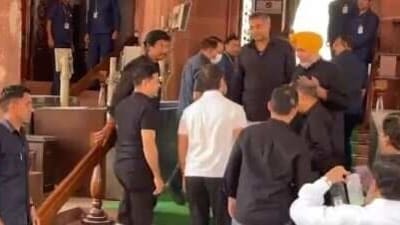 Rahul Gandhi (in white) entering the Parliament House complex on Wednesday as MPs including Karti Chidambaram, clad in black, welcome him.