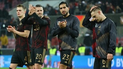 Germany's Emre Can and teammates applaud fans after the match (REUTERS)