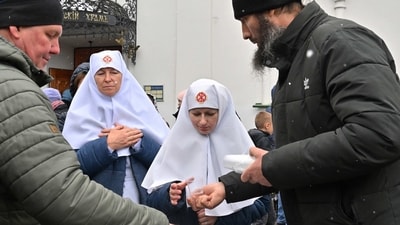 Nuns of Ukrainian Orthodox Church receive communion at the historic Kyiv-Pechersk Lavra in Kyiv on Wednesday. (AFP) Nuns of Ukrainian Orthodox Church receive communion at the historic Kyiv-Pechersk Lavra in Kyiv on Wednesday. (AFP)