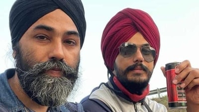 In the picture, it appears that Amritpal Singh and Papalpreet Singh are sitting atop a truck. In the picture, it appears that Amritpal Singh and Papalpreet Singh are sitting atop a truck.