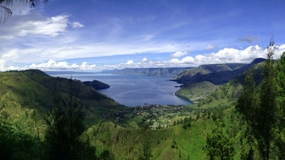 Lake Toba, Indonesia: Lake Toba is the largest volcanic lake in the world, located in the northern part of Sumatra. The lake is surrounded by stunning mountain scenery, making it a popular destination for trekking and hiking. Visitors can also explore traditional Batak villages and learn about the local culture. (Unsplash) Lake Toba, Indonesia: Lake Toba is the largest volcanic lake in the world, located in the northern part of Sumatra. The lake is surrounded by stunning mountain scenery, making it a popular destination for trekking and hiking. Visitors can also explore traditional Batak villages and learn about the local culture. (Unsplash)