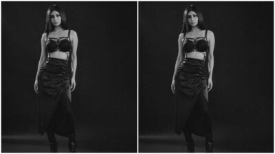 Mouni looked like a billion bucks in a black corset bra with leather slip sleeves and leather belt patterns across the neckline. She further teamed it with a long bodycon leather skirt with a thigh high slit.&nbsp; (Instagram/@imouniroy)