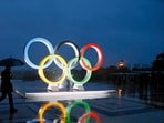 FILE - A display of the Olympic rings is set up on Trocadero plaza that overlooks the Eiffel Tower, after the vote in Lima, Peru, awarding the 2024 Games to the French capital, in Paris, France, Wednesday, Sept. 13, 2017. A proposed French law for the 2024 Paris Olympics that critics contend will open the door for privacy busting video surveillance technology in France and elsewhere in Europe faces an important hurdle Tuesday March 28, 2023 with lawmakers set to vote on it. The bill would legalize the temporary use of so-called "intelligent" surveillance systems to safeguard the Games and Paralympics. (AP Photo/Francois Mori, File)