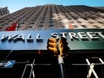 A sign for a Wall Street building is shown, A sign for a Wall Street building is shown,