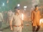 A police personnel carries out flag march in Howrah following clashes on the occasion of Ram Navami.