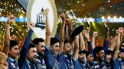 Gujarat Titans squad celebrates with the IPL trophy (ANI) Gujarat Titans squad celebrates with the IPL trophy (ANI)