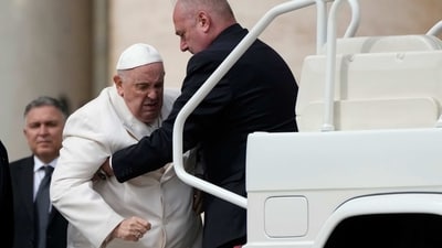 Pope Francis is helped into his car at the end of the weekly general audience in St. Peter's Square, at the Vatican. (AP) Pope Francis is helped into his car at the end of the weekly general audience in St. Peter's Square, at the Vatican. (AP)