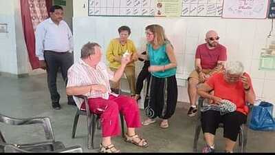 Foreign tourists bitten by bees being treated at the Primary Health Center in Fatehpur Sikri. (HT Photo)