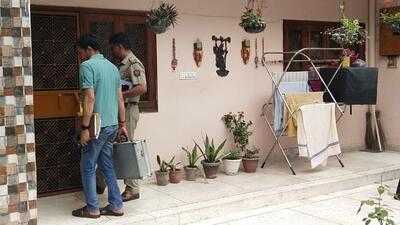 Investigators at the Sharma home in Abhay Khand 1 in Indirapuram in Ghaziabad on Thursday. (Sakib Ali/HT Photo)