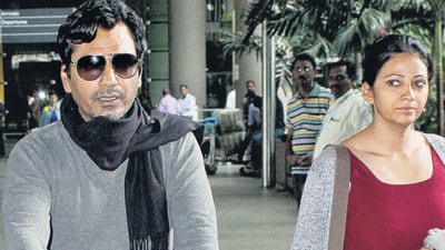 MUMBAI, INDIA - AUGUST 16, 2016 : Nawazuddin Siddiqui with his wife Aaliya and son Yaani was spotted at Airport on Tuesday August 16, 2016 in Mumbai, India. (Freelance photo by Yogen Shah) (Yogen Shah) MUMBAI, INDIA - AUGUST 16, 2016 : Nawazuddin Siddiqui with his wife Aaliya and son Yaani was spotted at Airport on Tuesday August 16, 2016 in Mumbai, India. (Freelance photo by Yogen Shah) (Yogen Shah)