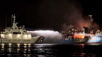 Philippine Passenger Ferry Fire: Philippine Coast Guard spraying water on a fire onboard the Lady Mary Joy 3 during a search and rescue operation. (AFP) Philippine Passenger Ferry Fire: Philippine Coast Guard spraying water on a fire onboard the Lady Mary Joy 3 during a search and rescue operation. (AFP)