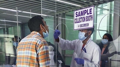 Passenger undergoes Covid-19 test at the Kolkata airport. (PTI / File) Passenger undergoes Covid-19 test at the Kolkata airport. (PTI / File)