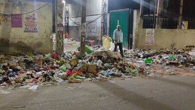 With the garbage workers continuing their strike for the third day on Thursday, mounds of garbage remained piled along roadsides in Kharar. (HT Photo)