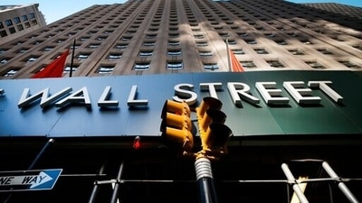A sign for a Wall Street building is shown, (AP file photo) A sign for a Wall Street building is shown, (AP file photo)