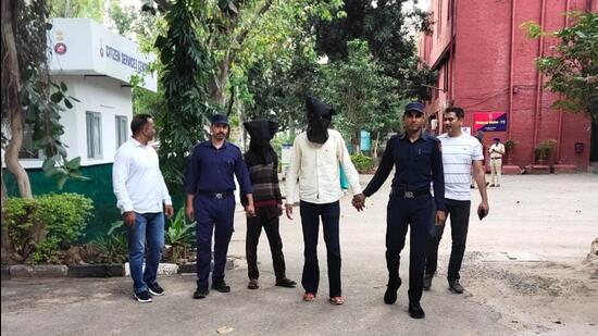 The accused in police custody. Among those arrested is Sahil, alias Mukul Rana, 26, of Maloya in Chandigarh, who had been residing in Mohali. He is said to be the key accused, who was nabbed by the team led by inspector Amanjot Singh. (HT Photo)