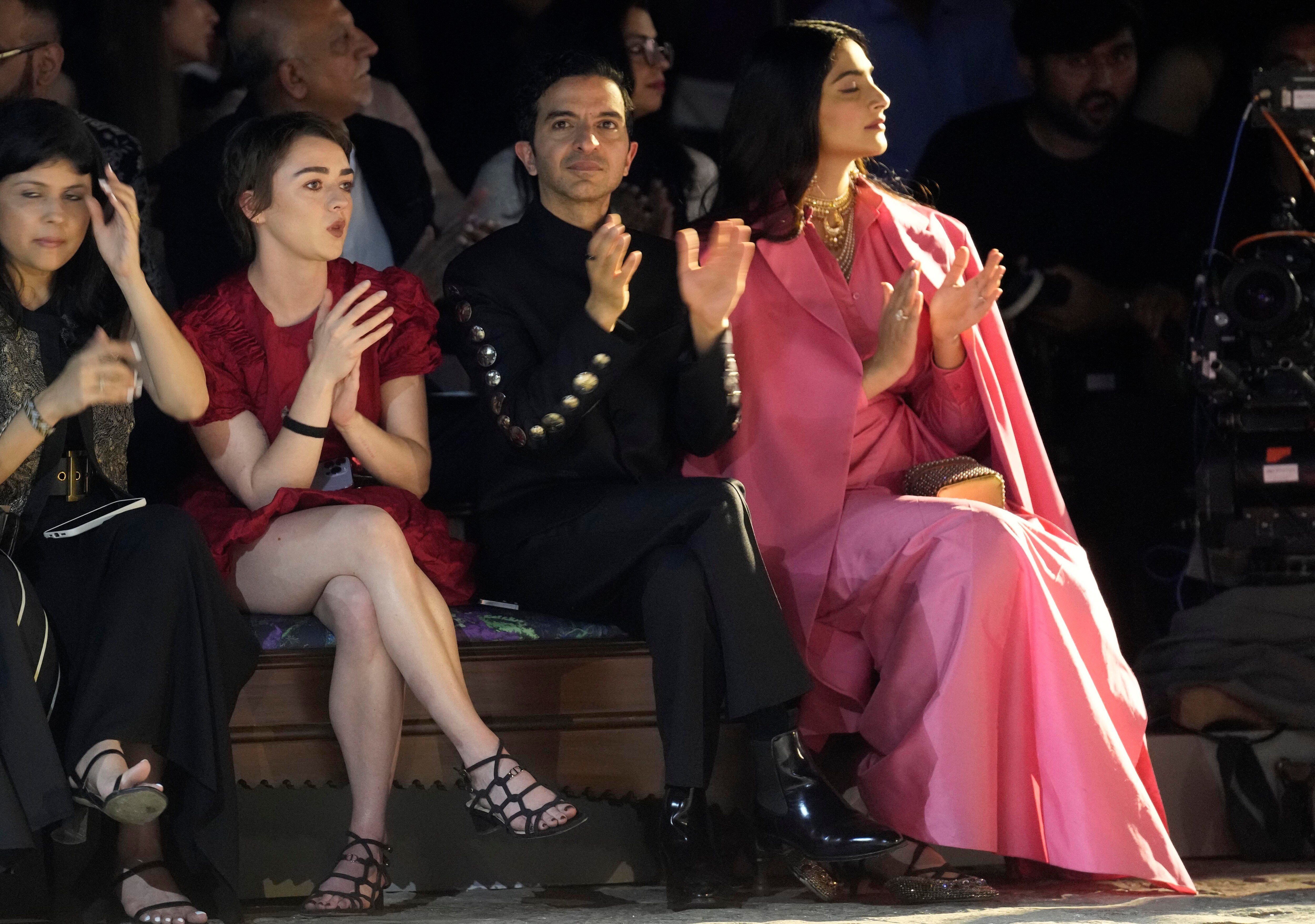 Game of Thrones' star Maisie Williams, second left, and Bollywood actress Sonam Kapoor, right, applaud at the end of the Dior Pre-Fall 2023 collection at the Gateway of India landmark monument in Mumbai, India, Thursday, March 30, 2023. (AP Photo/Rafiq Maqbool) (AP) Game of Thrones' star Maisie Williams, second left, and Bollywood actress Sonam Kapoor, right, applaud at the end of the Dior Pre-Fall 2023 collection at the Gateway of India landmark monument in Mumbai, India, Thursday, March 30, 2023. (AP Photo/Rafiq Maqbool) (AP)