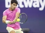 Carlos Alcaraz, of Spain, returns a volley against Taylor Fritz, of the United States, in the first set of a match at the Miami Open Carlos Alcaraz, of Spain, returns a volley against Taylor Fritz, of the United States, in the first set of a match at the Miami Open