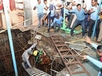 Rescuers at the temple in Indore. (ANI) Rescuers at the temple in Indore. (ANI)