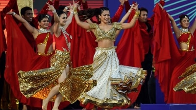 After Tamanna's performance, actress Rashmika Mandanna (C) put in the final performance. (AFP) After Tamanna's performance, actress Rashmika Mandanna (C) put in the final performance. (AFP)