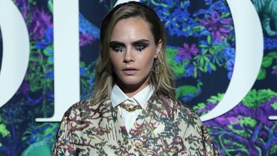 Model-actor Cara Delevingne wore a multi-coloured short dress with a white shirt and black belt. (PTI) Model-actor Cara Delevingne wore a multi-coloured short dress with a white shirt and black belt. (PTI)
