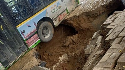 As per visuals uploaded by Delhi Traffic Police in its advisory, it can be seen that a Delhi Transport Corporation (DTC) bus got stuck in in the pothole. As per visuals uploaded by Delhi Traffic Police in its advisory, it can be seen that a Delhi Transport Corporation (DTC) bus got stuck in in the pothole.