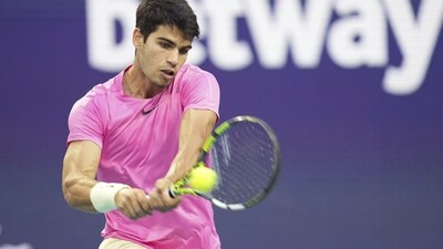 Carlos Alcaraz, of Spain, returns a volley against Taylor Fritz, of the United States, in the first set of a match at the Miami Open (AP) Carlos Alcaraz, of Spain, returns a volley against Taylor Fritz, of the United States, in the first set of a match at the Miami Open (AP)