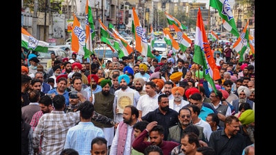 Punjab Congress chief Amrinder Singh Raja Warring with Leader of the opposition Partap Singh Bajwa and supporters during a protest march against the disqualification of Congress leader Rahul Gandhi from the Lok Sabha, in Jalandhar on Friday. (PTI)