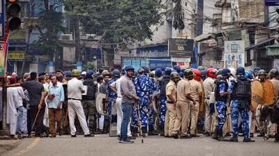 Security personnel cordon off an area after clashes broke out between two groups during a Ram Navami procession, in Howrah district. (PTI) Security personnel cordon off an area after clashes broke out between two groups during a Ram Navami procession, in Howrah district. (PTI)